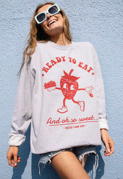 Model wears fruit slogan sweatshirt