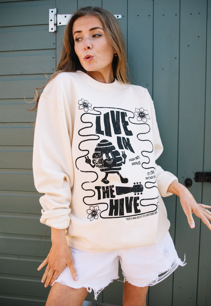 Model wears 70s festival inspired graphic jumper