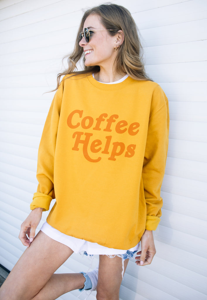 Model wears fun coffee slogan sweater 