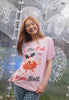 joyful image of female model wearing vintage style printed christmas pudding t-shirt with positive slogan print