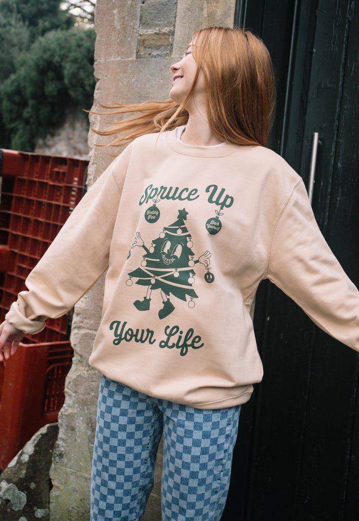 womens christmas sweatshirt in sand colour with vintage christmas tree print and positive slogan