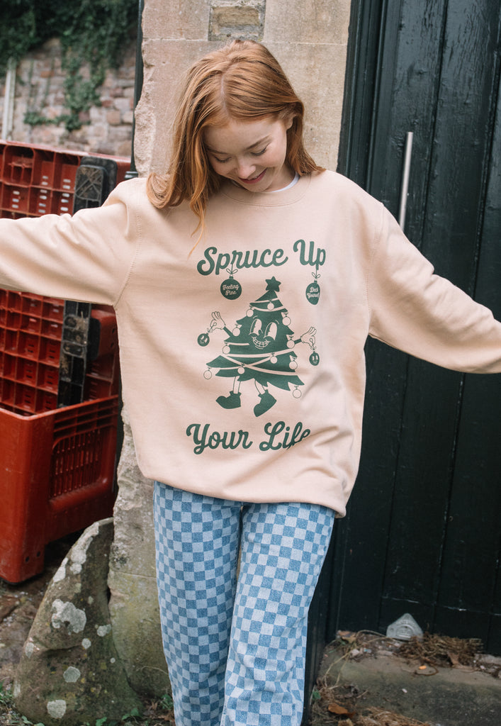 positive christmas slogan jumper with smiling christmas tree character print on front