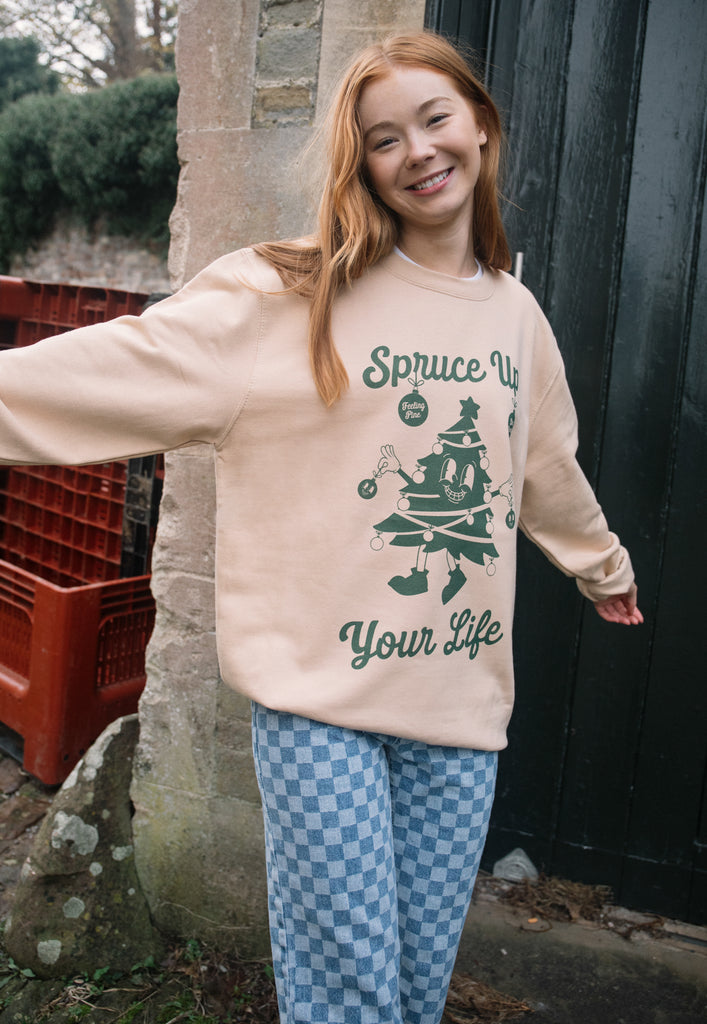 Christmas jumper for women with vintage style green christmas tree character logo printed on natural base