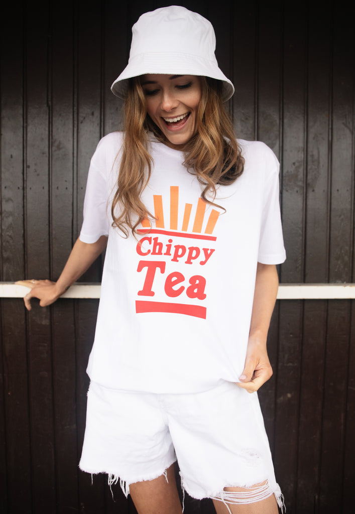 Model wears white tshirt with Chippy Tea slogan and fries graphic 