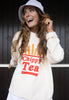 Model wears vanilla sweatshirt with Chippy Tea slogan and fries graphic 