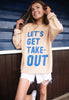 Model wears nude sweatshirt with Let's Get Takeout slogan 