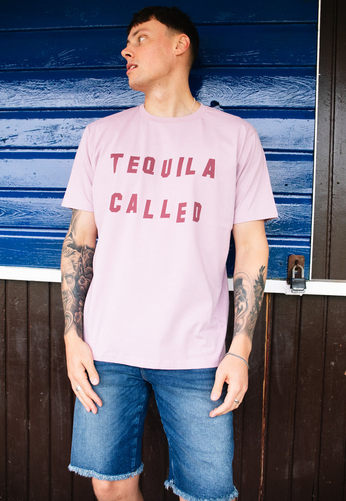 Model wears dusty purple tshirt with Tequila Called slogan 