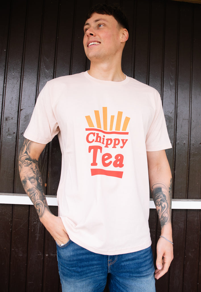 Model wears dusty peach tshirt with Chippy Tea slogan and fries/chips graphic