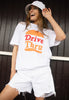 Model wears white tshirt with Drive Thru slogan and Burger Graphic 