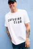 Model wears white tshirt with Caffeine club slogan 
