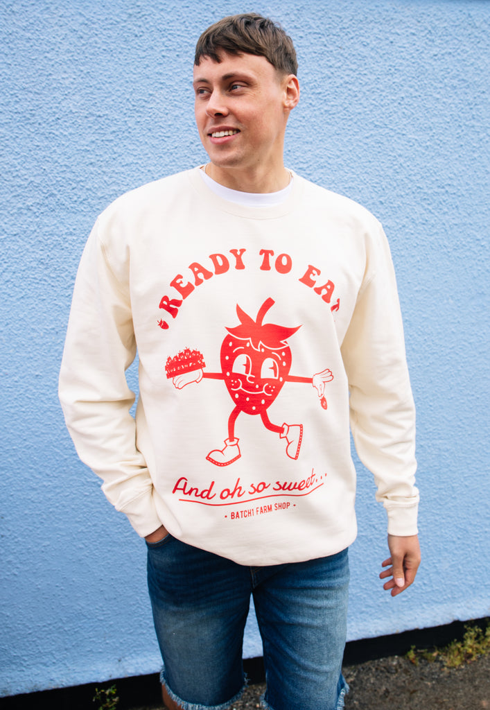 Model wears vanilla sweatshirt with printed strawberry ready to eat graphic 