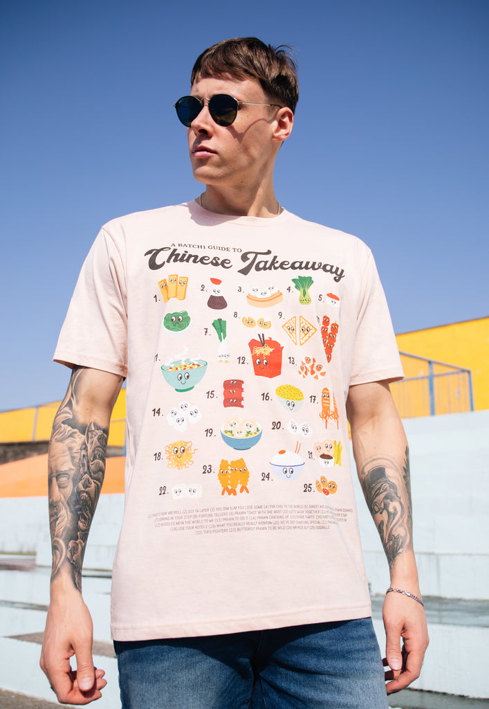 Model wears dusty peach graphic t-shirt with vintage character