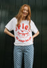female model wears white printed christmas t shirt with large mince pie character design and pie will always love you slogan