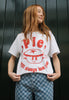 close up image of female model wearing white printed christmas t shirt featuring mince pie guy character and pie will always love you slogan
