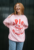 Pink christmas jumper with printed mince pie character and slogan