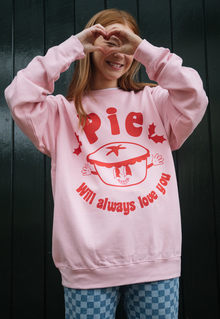 womens pink christmas jumper with mince pie graphic