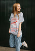 uplifting image of female model wearing fun festive t-shirt in vintage style with gravy theme and cute character 