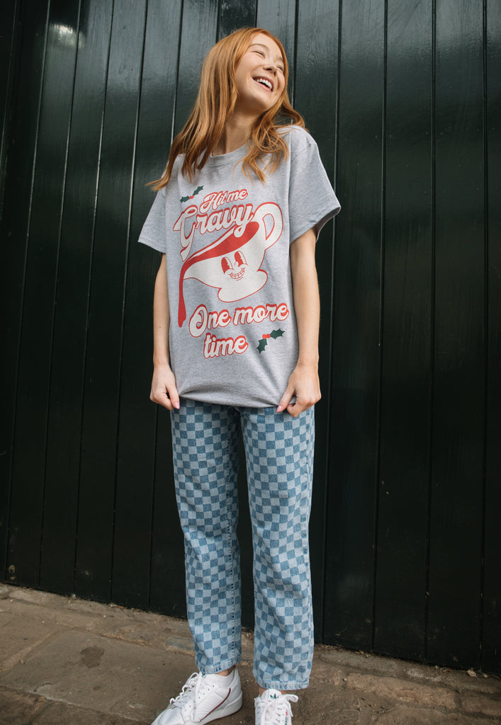happy image of female model wearing vintage style christmas t shirt in unisex fit with retro gravy graphic and funny slogan