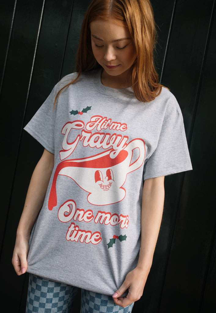 female model wears vintage style printed christmas t shirt with gravy graphic and funny slogan