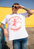 male model wears short sleeved white t shirt with printed vintage hot dog characters and you're on to a wiener slogan