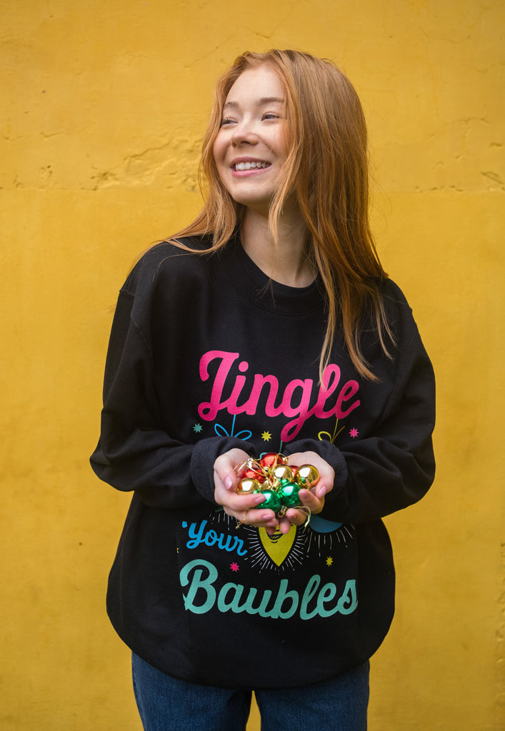 cute women's christmas jumper featuring colourful baubles and funny slogan on black base
