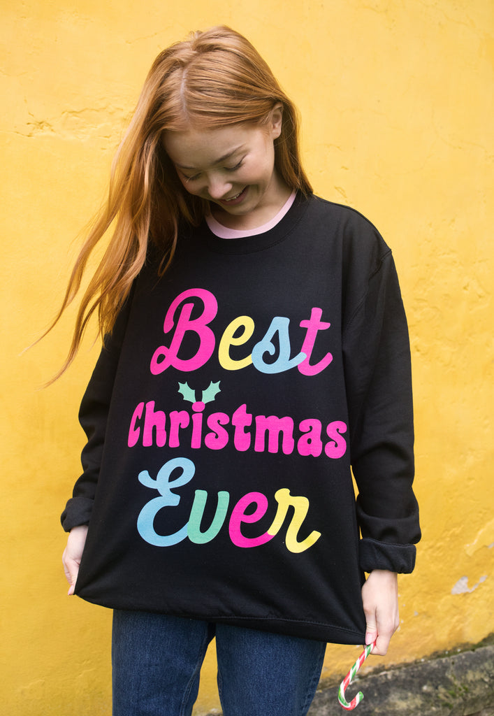 womens christmas jumper in black with bright best christmas ever slogan