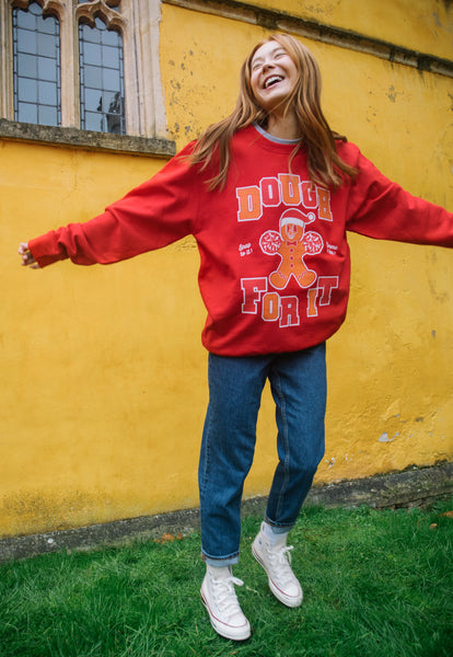 bright red fun christmas jumper with dough for it slogan and gingerbread man 