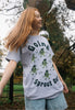 joyful image of female model wearing christmas t shirt with vintage sprouts theme