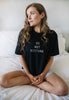 Female model wears relaxed fit crew neck tee with Do Not Disturb slogan