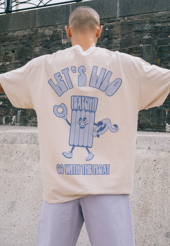 unisex back print t shirt in neutral sand colour with fun pool float character and summer slogan