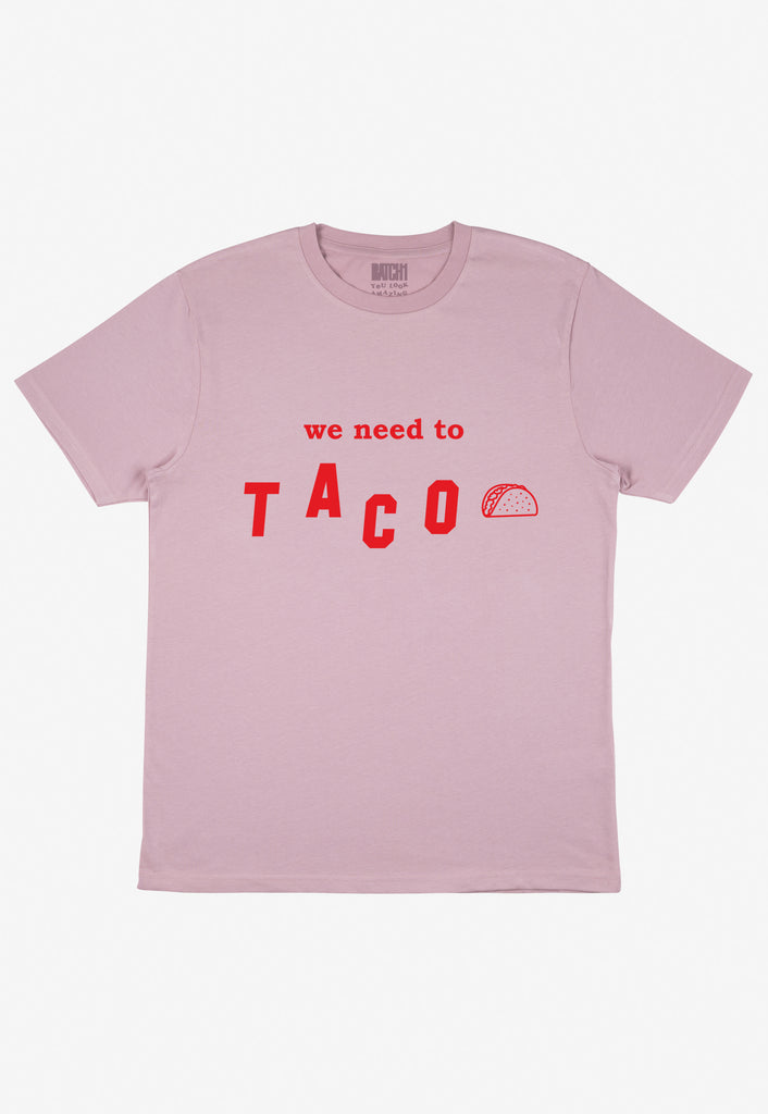 flatlay of pastel purple t-shirt with printed taco slogan and taco graphic