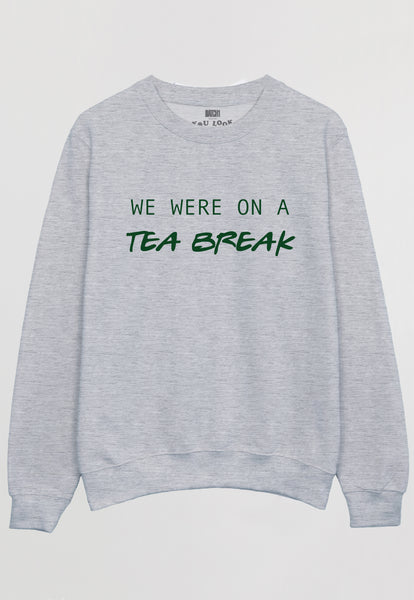 Flatlay of grey sweatshirt with We were on a Tea Break slogan 