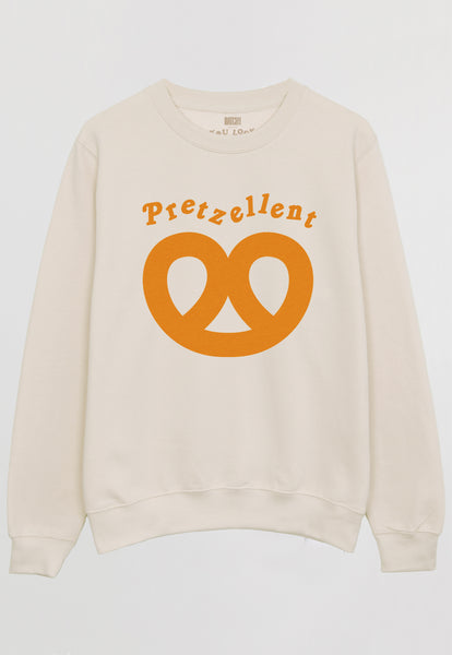 Flatlay of vanilla sweatshirt with Pretzellent slogan and pretzel graphic 