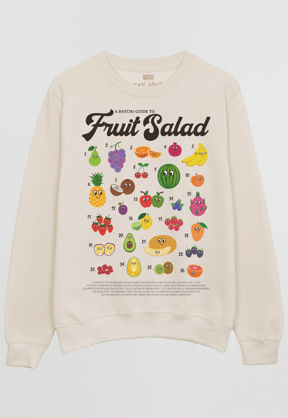Flatlay of vanilla sweatshirt with fruit salad guide printed graphic 