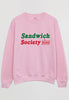 Flatlay of pink sweatshirt printed with sandwich slogan
