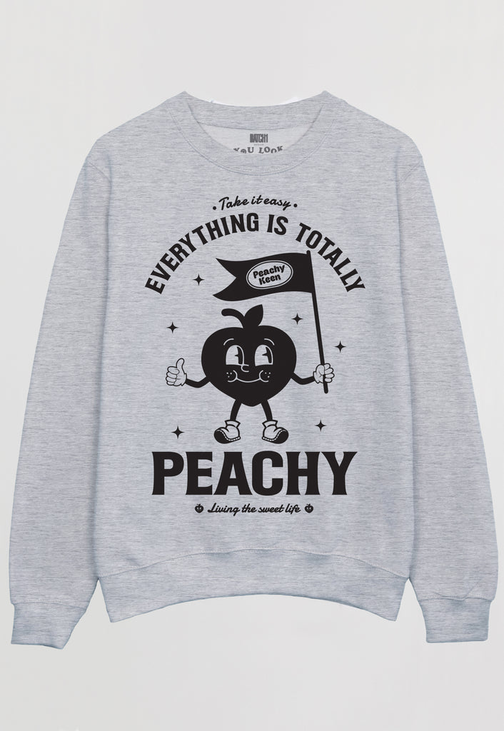 Flatlay of grey sweatshirt with everything is peachy graphic 