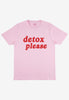 Flatlay of light pink t-shirt with printed detox slogan on front