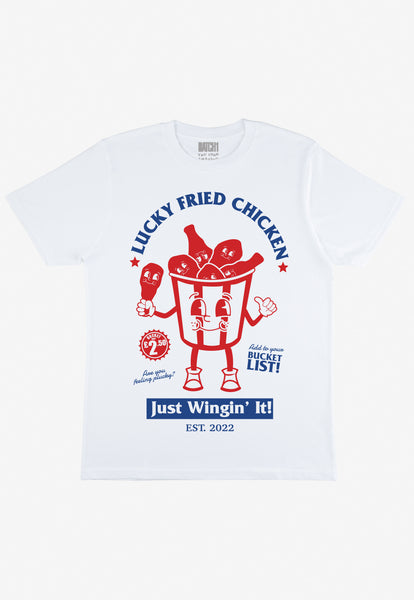flatlay of men's white t shirt with chicken shop mascot and lucky fried chicken slogan print