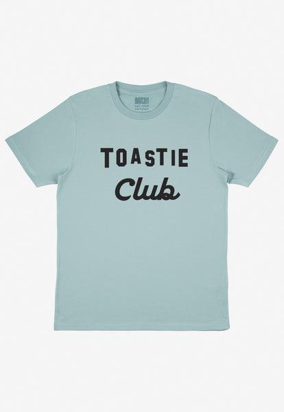 Flatlay of dusty green tshirt with Toastie club slogan 