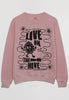 Flatlay of dusty pink sweatshirt with Live in The Hive festival slogan 