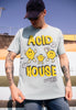 Model wears dusty green tshirt with Acid House festival slogan and lemon character