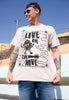 Model wears sand tshirt with Live in The Hive festival slogan 