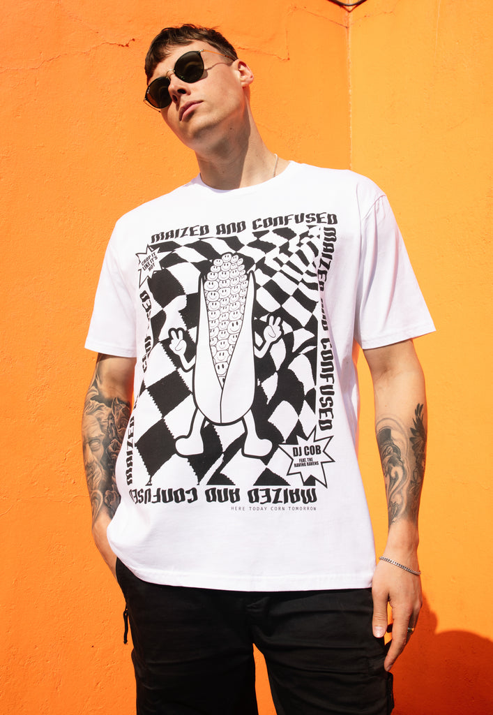 male model wears white t shirt with 90s rave style poster print and corn character