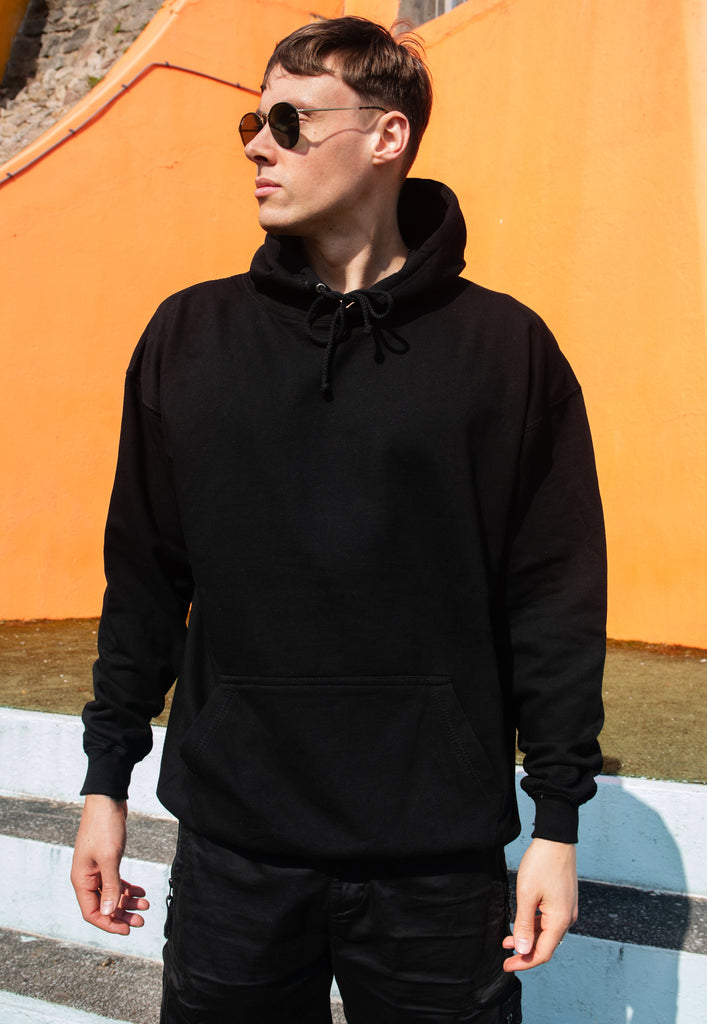 model wears black hoodie with Garden Beats festival slogan and poster graphic plain front print 